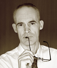 Bruno Quinquet Bruno Quinquet as director. 2013 sepia formal portrait.