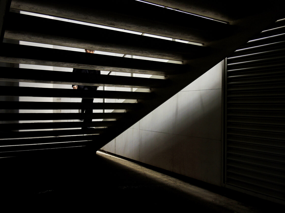 a salaryman walking up a stairway in Shinjuku
